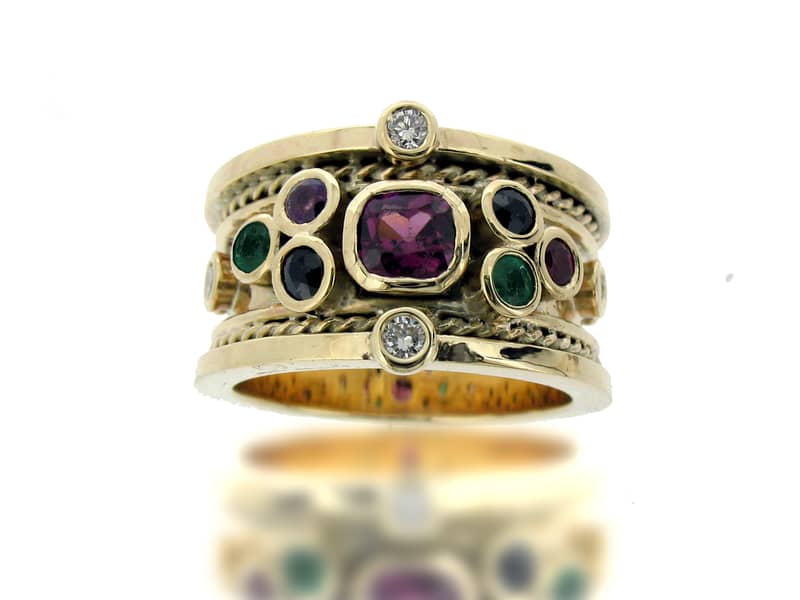 Gold drum ring with rubies, emeralds, diamonds, sapphires and amethysts
