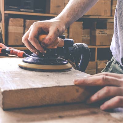 sanding reclaimed wood shelf