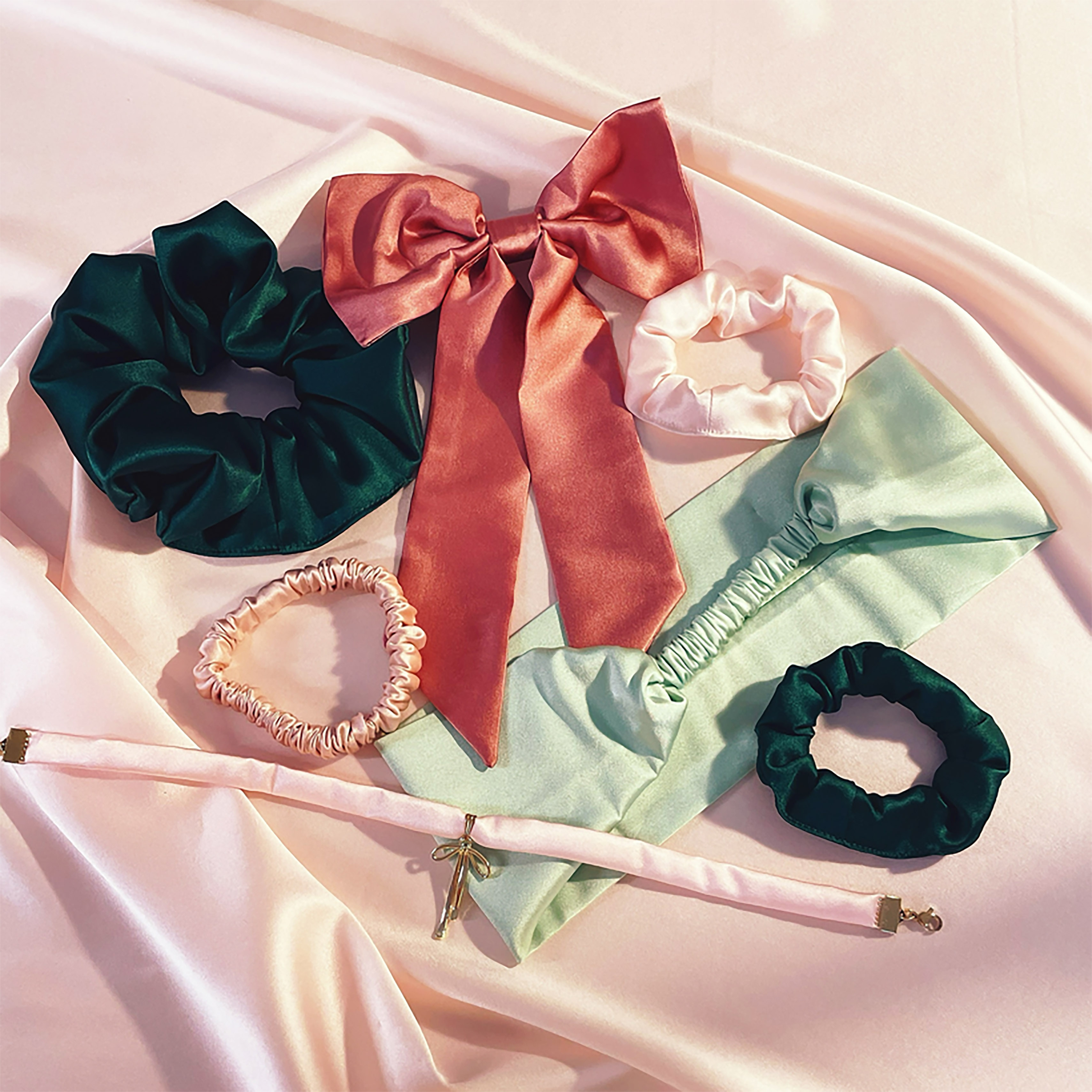 Deep green silk scrunchie, mid pink hair bow, mini pale pink scrunchie, pink hair elastic, pale green headband, pale pink silk choker and mini green scrunchie