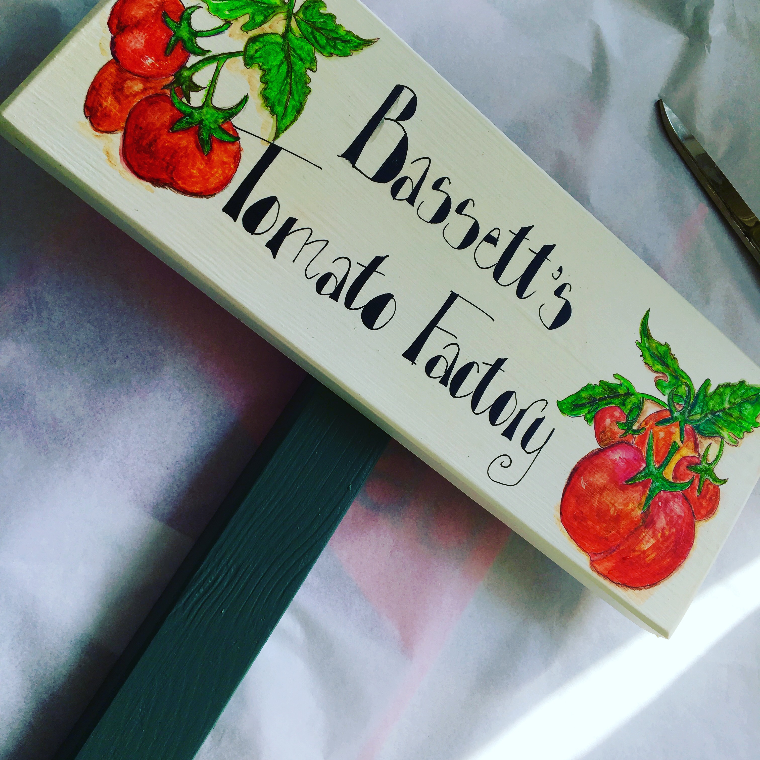 Wooden outdoor sign on a stake