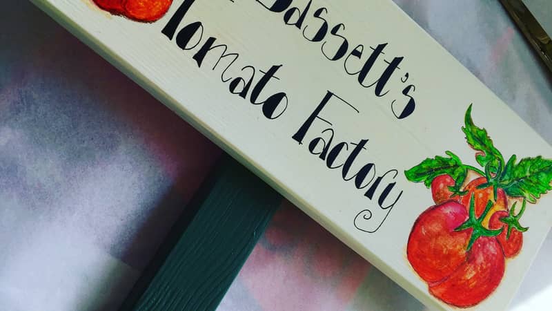 Wooden outdoor sign on a stake