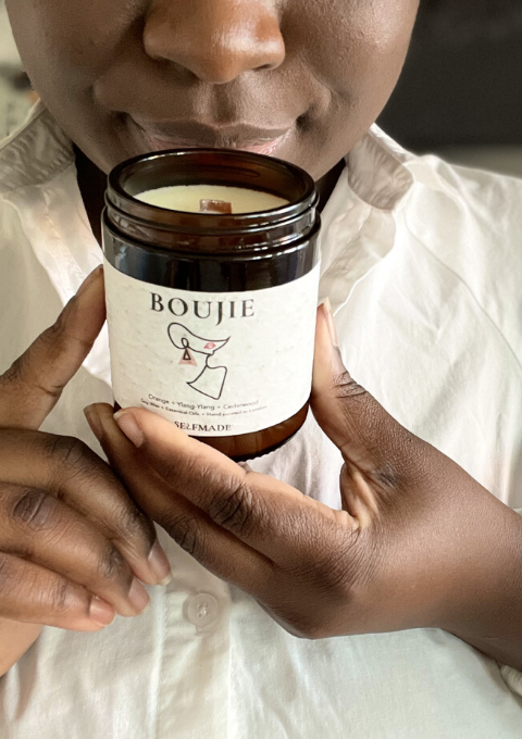 Ricki holding a boujie candle