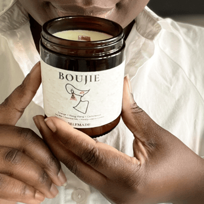 Ricki holding a boujie candle