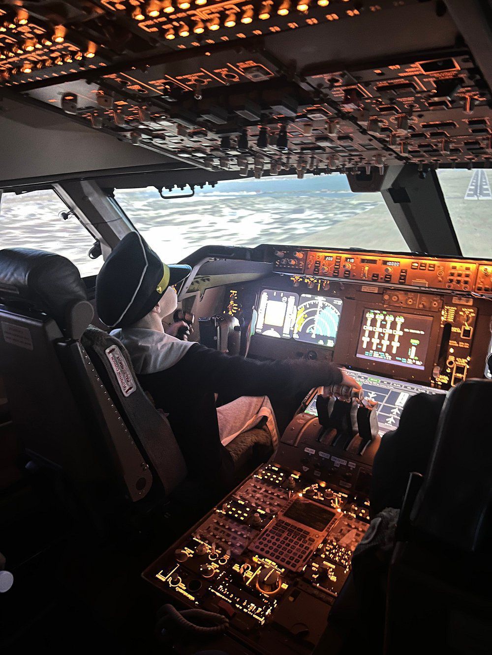 Kid flying in cockpit