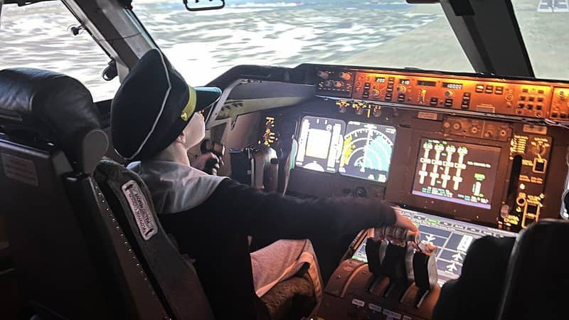 Kid flying in cockpit