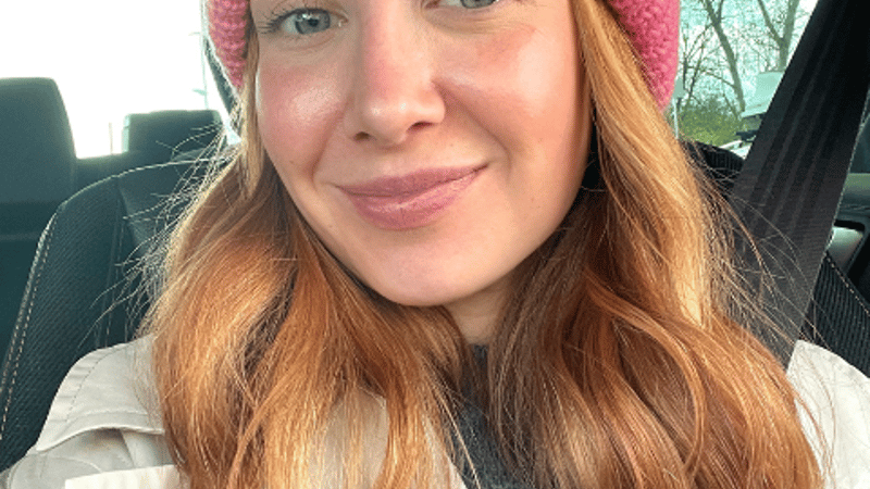 A photograph of the owner of By Honey Studios