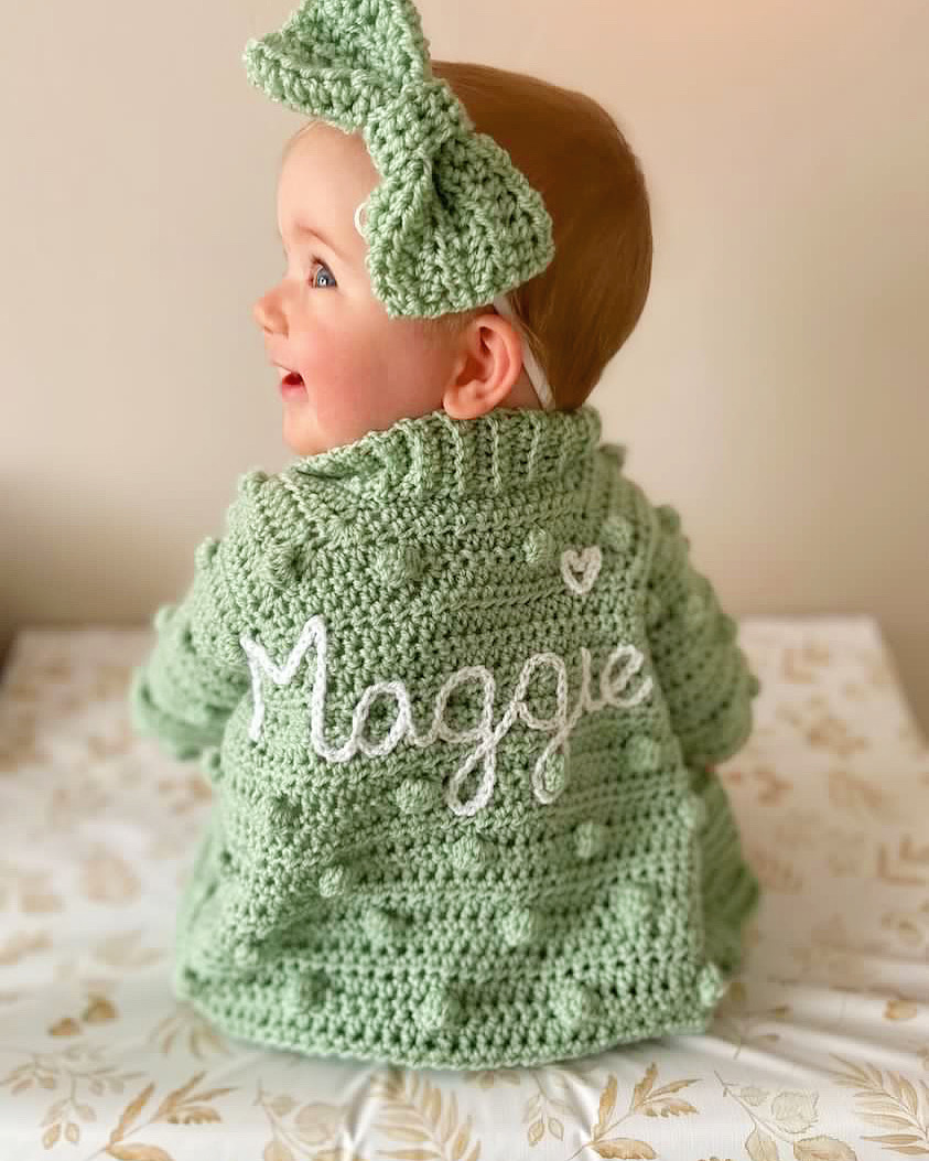 Crochet baby cardigan with hand embroidered name on the back 