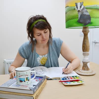 UK illustrator Ceridwen Hazelchild creating whimsical woodland artwork in her home studio for prints and children’s lampshades.