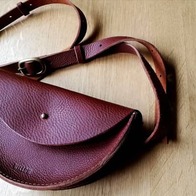 Tan halfmoon leather crossbody bag