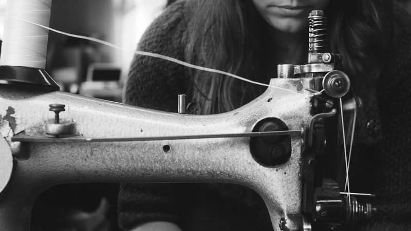 At the sewing machine