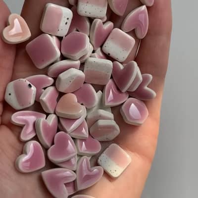 handful of pink ceramic stud earrings
