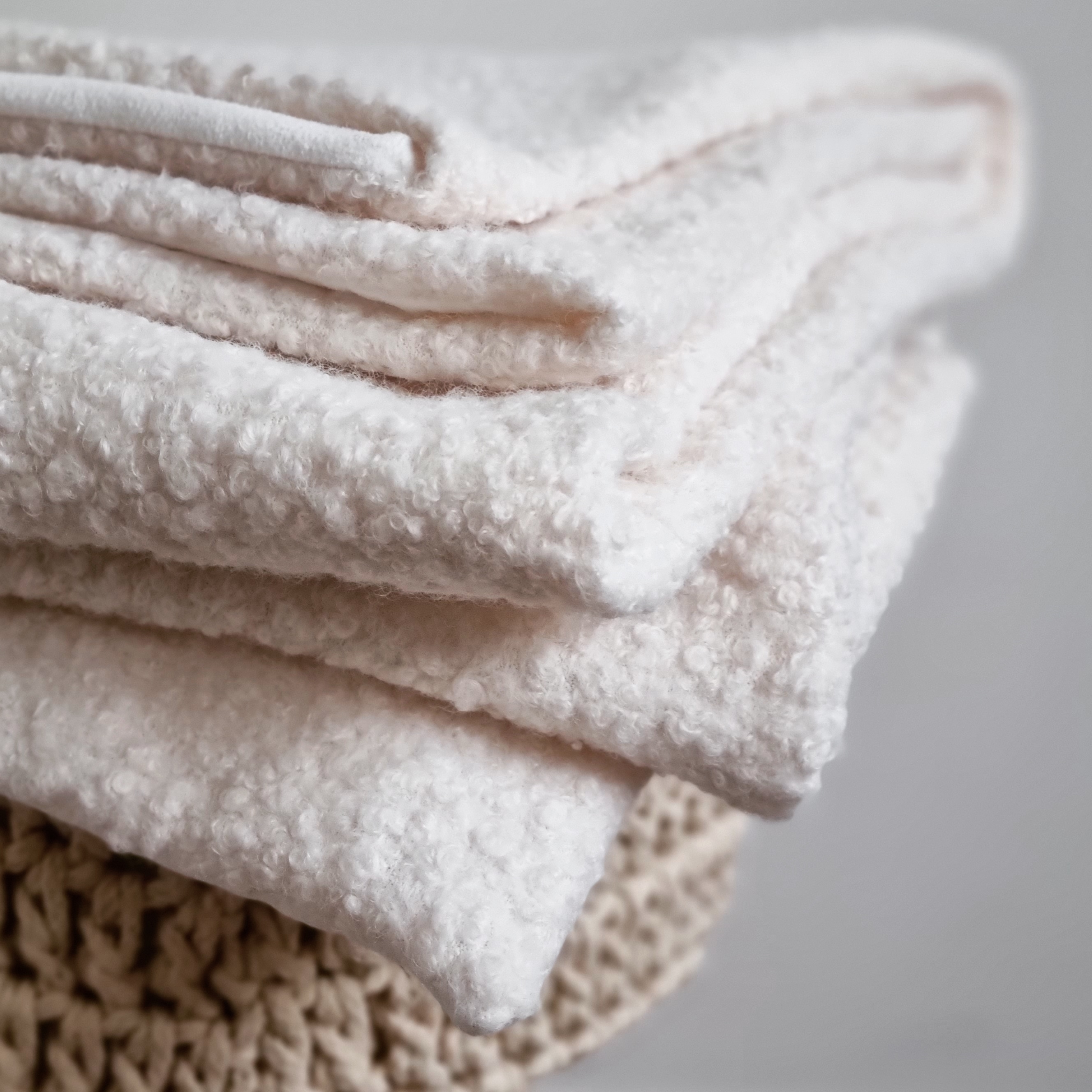 Folded Boucle throw displaying all the layers of texture