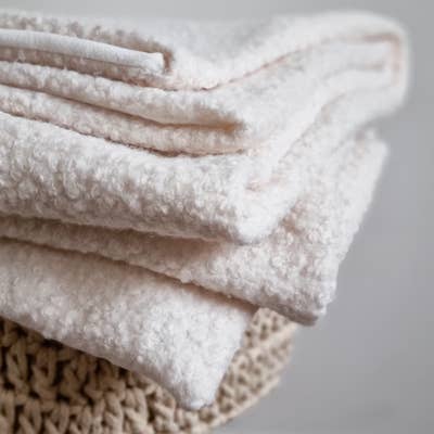 Folded Boucle throw displaying all the layers of texture