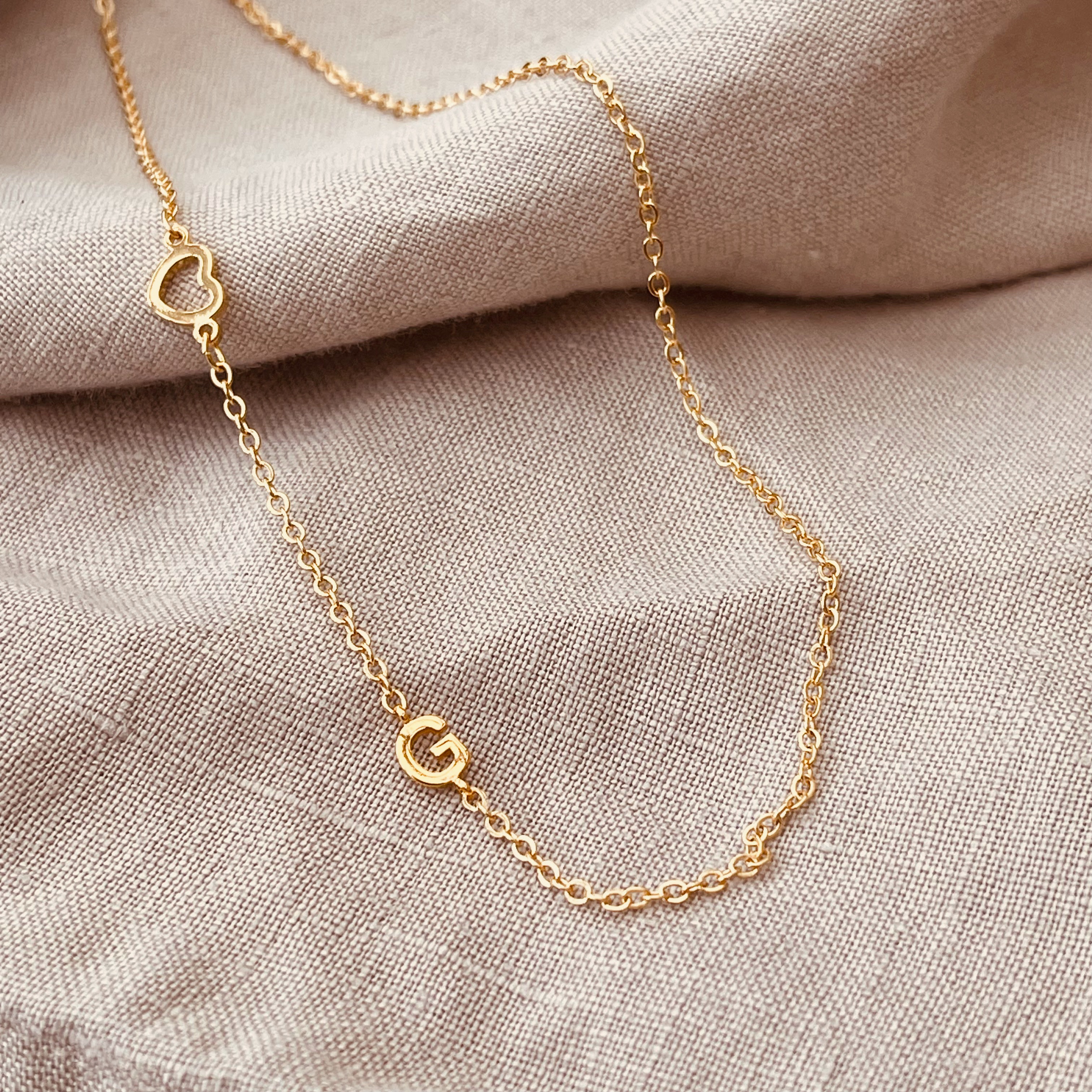 Asymmetric Initial Necklace