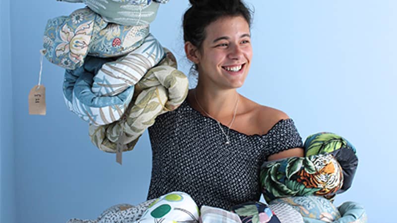 Adonia holding Mini Squish Knot Cushions