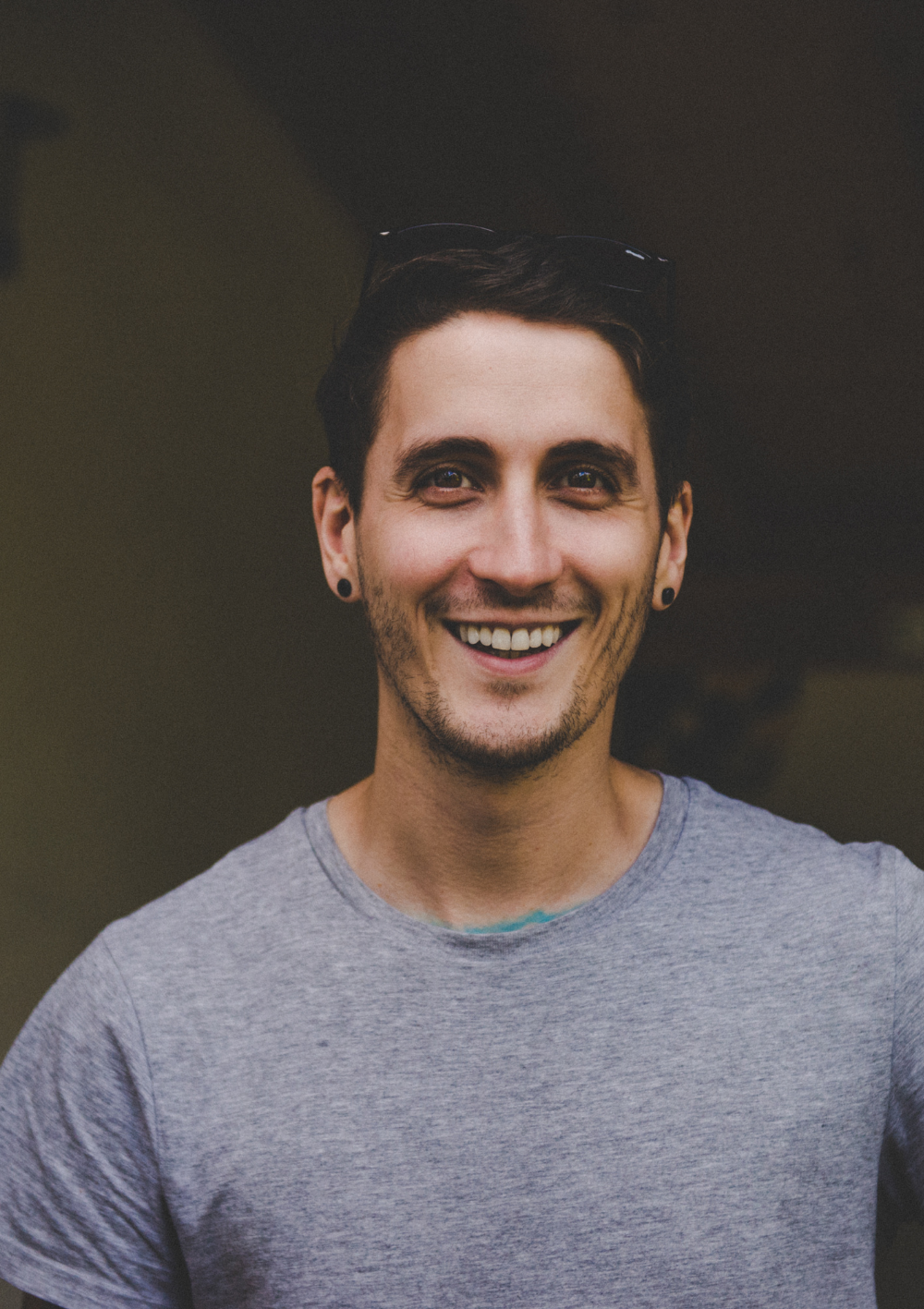 The owner of Shoreline Shaving stood in a town square in Munich holding a paper heart