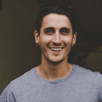 The owner of Shoreline Shaving stood in a town square in Munich holding a paper heart