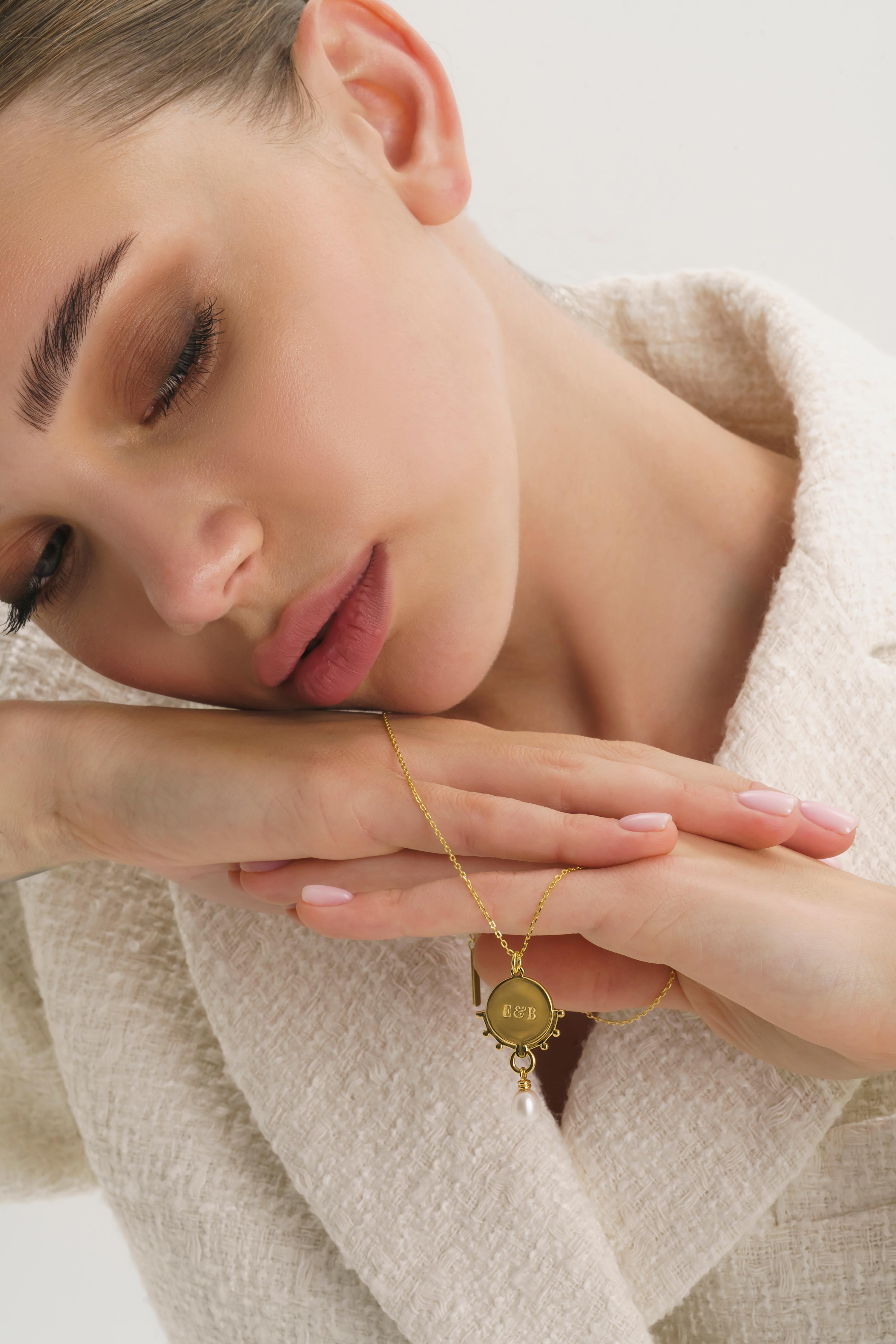 Thick gold statement ring with gold coin choker and necklaces