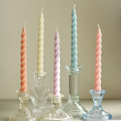 Pastel candles and candlesticks / candle holders