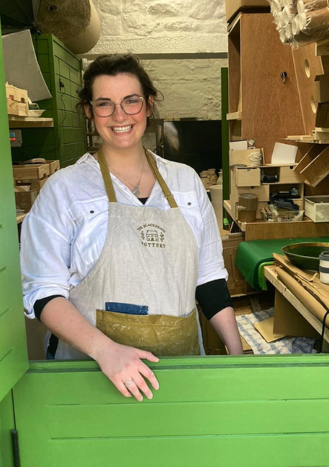 potter working in her studio
