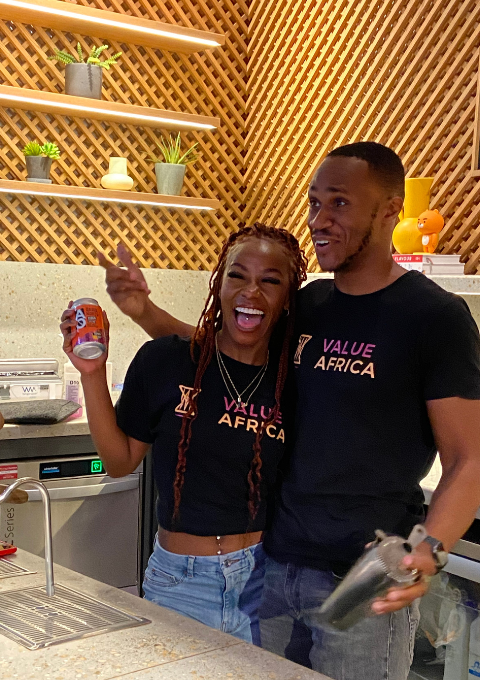 Founder of Value Africa laughing while serving Africa's best