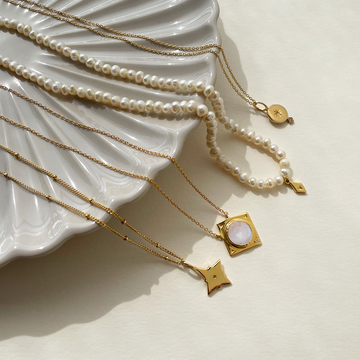 Flat Lay of Eliza Asta Jewellery in trinket dish.