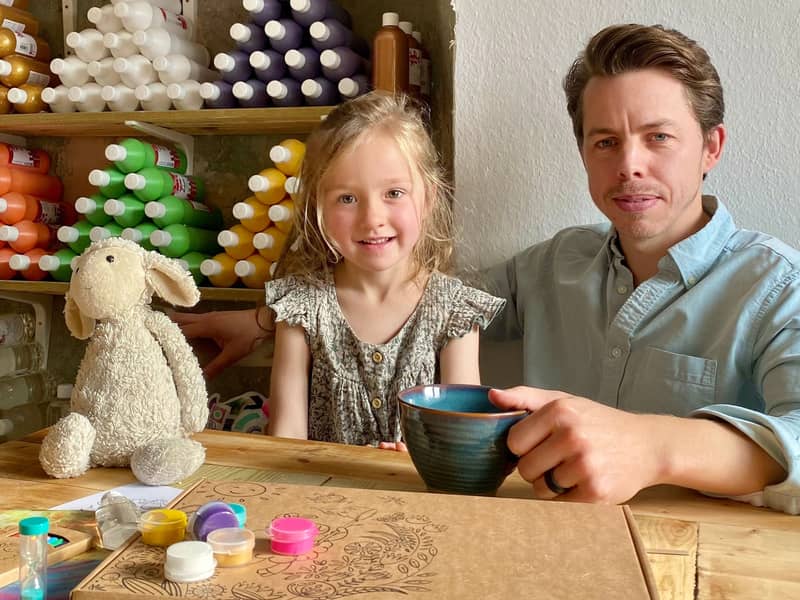 Founder, Ben, with daughter Evie and 'Ewe' in the workshop.