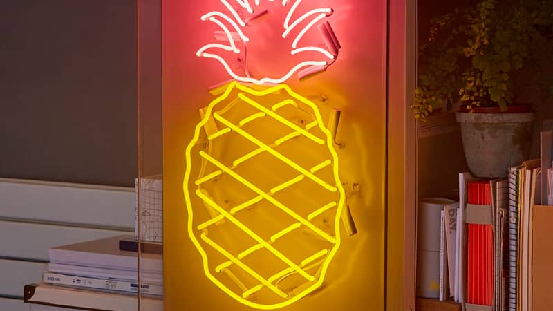 2 colour pineapple real glass neon sign with pink leaves and yellow criss cross fruit section on white background