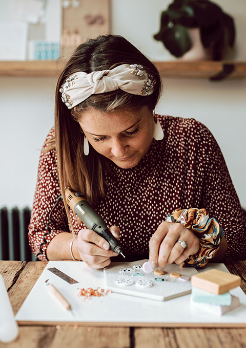 Melissa creating polymer clay earrings