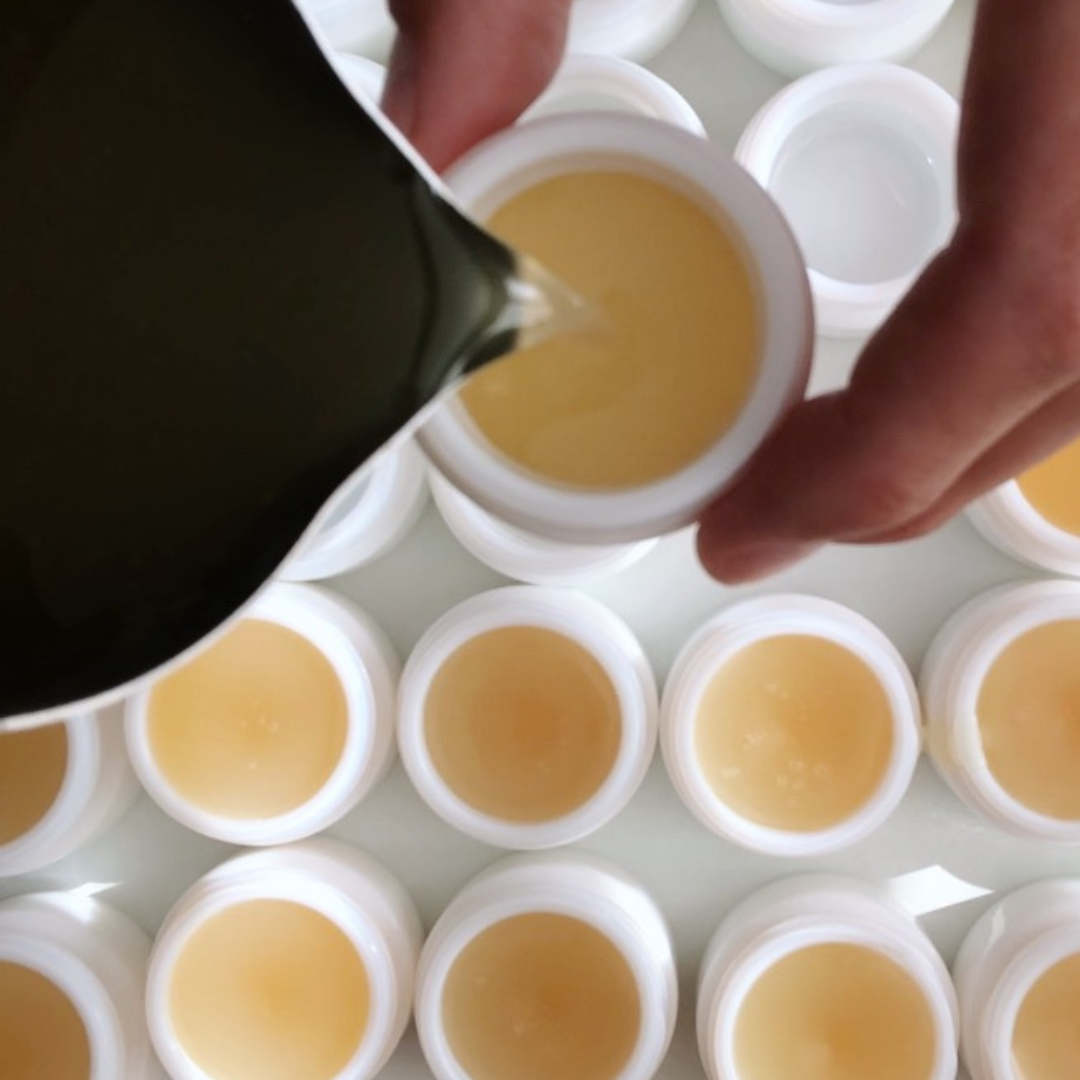 Female aromatherapist mixing a blend in her aromatherapy studio