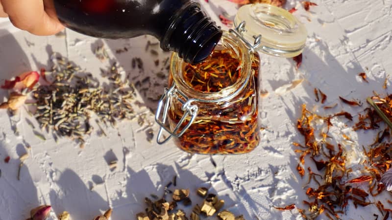natural skincare oil infusion with calendula petals and herbs