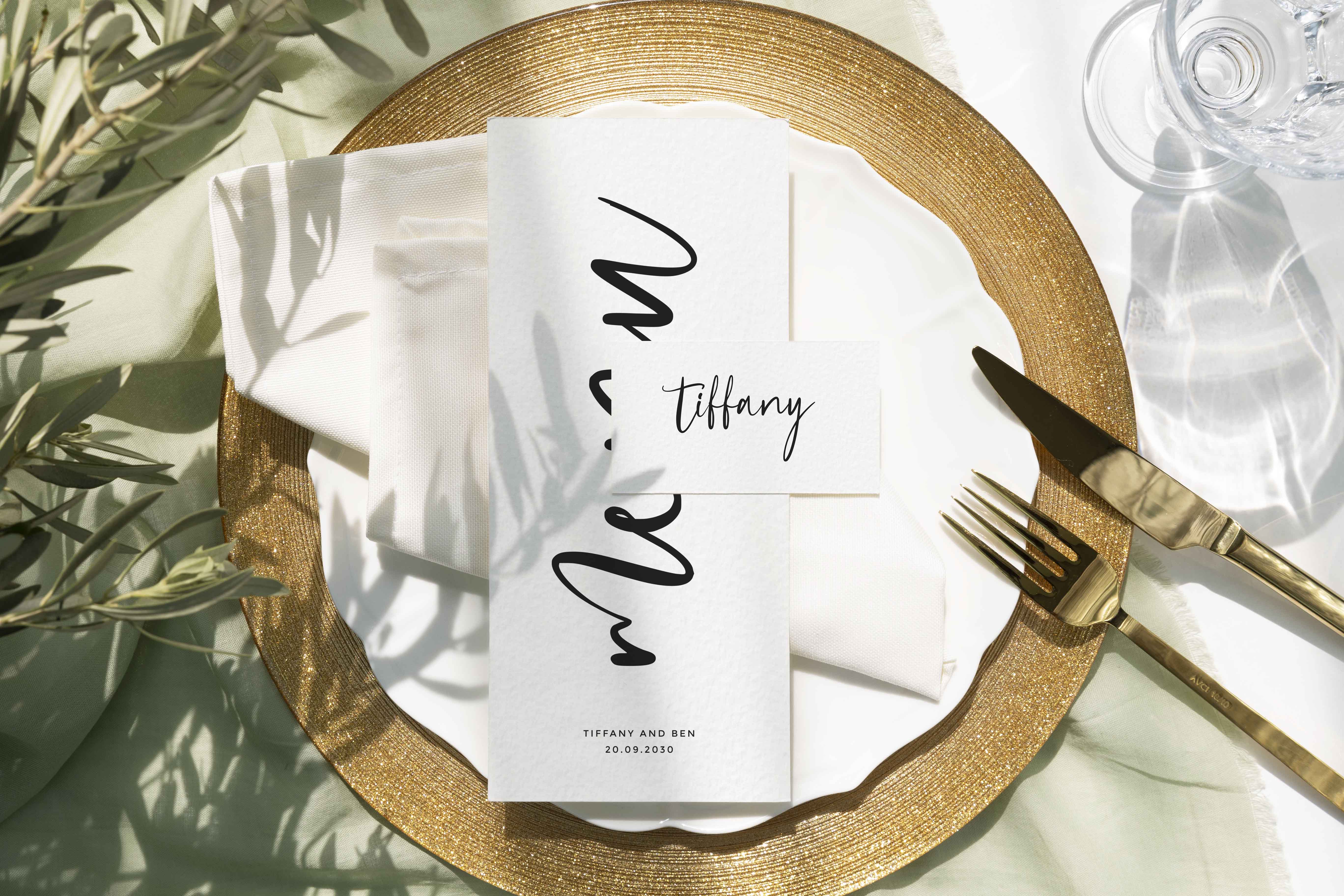 Black and white wedding menu and place card with a modern calligraphy style typeface