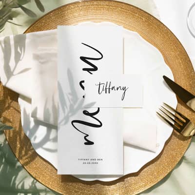 Black and white wedding menu and place card with a modern calligraphy style typeface