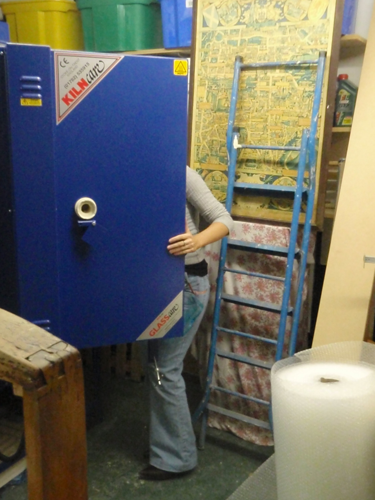 Jessica Irena Smith at work in her glass studio - loading the kiln