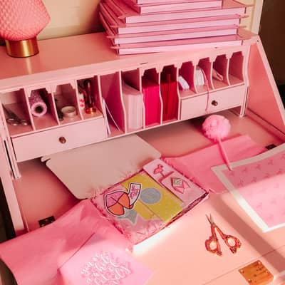 Upcycled vintage bureau used as a packing station