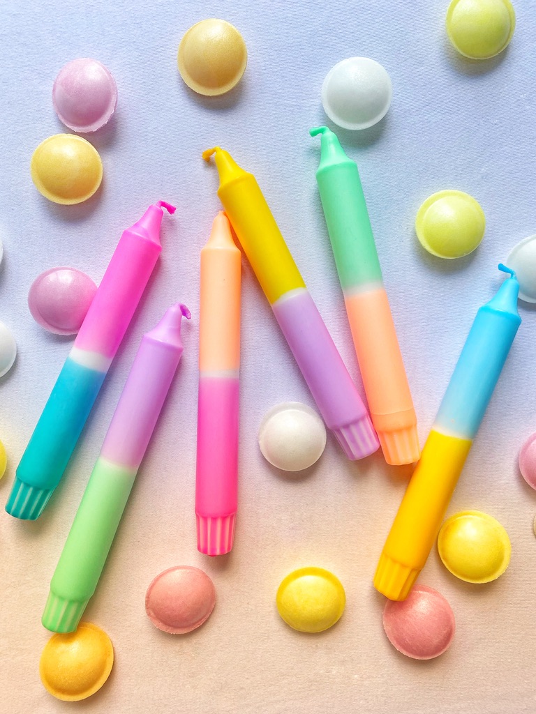 6 candles in sugary summer colours are surrounded by flying saucer sweets