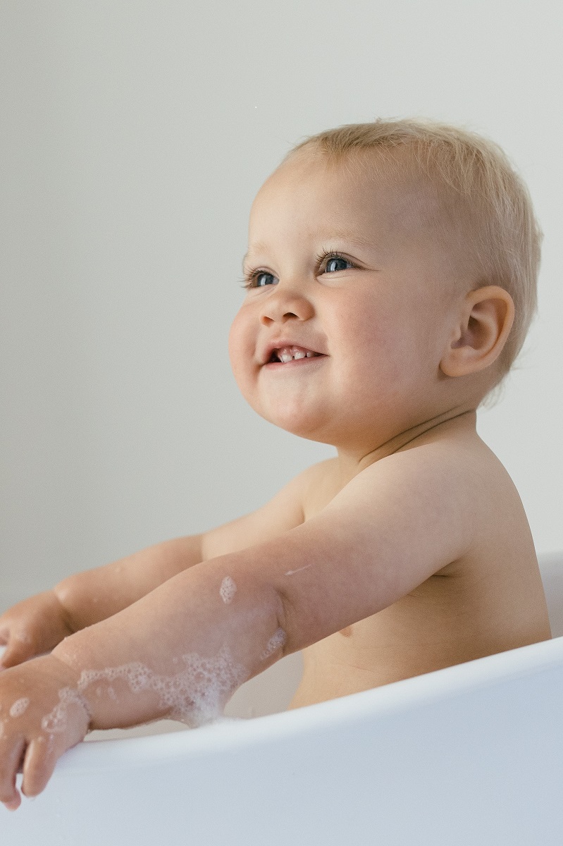 Baby washing in a bath