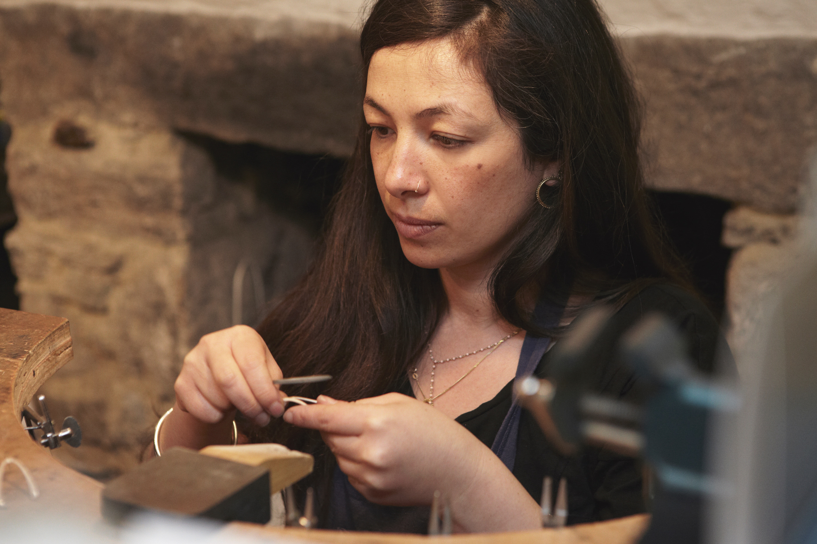 Yume making jewellery at work bench