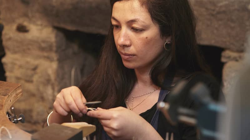 Yume making jewellery at work bench