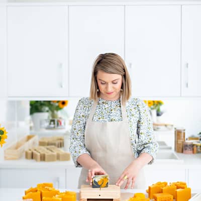 Soapmaker cutting soap