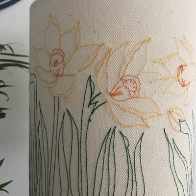 Each lampshade is wrapped in tissue and finished off with a ribbon.