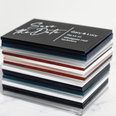 Stack of save the dates in various colours