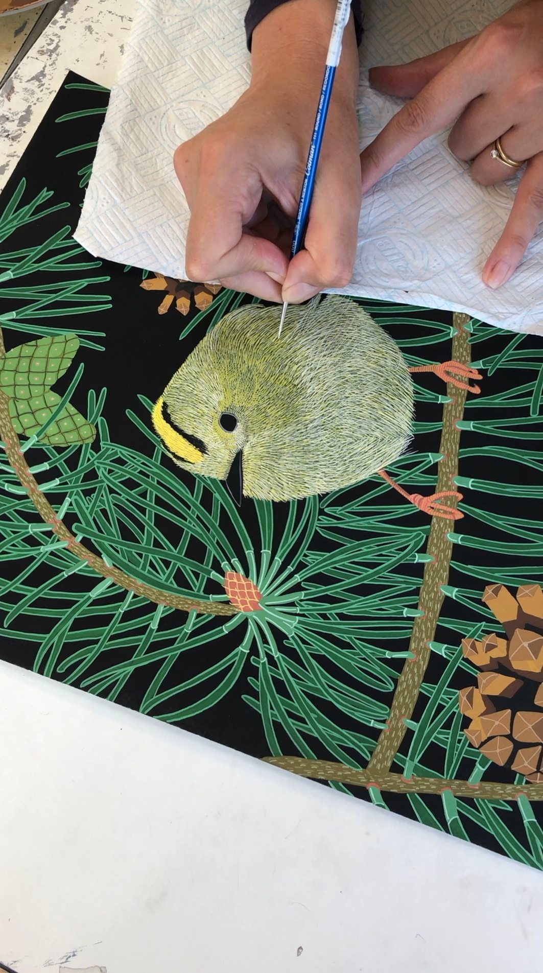 Bird the artist painting a Godlcrest