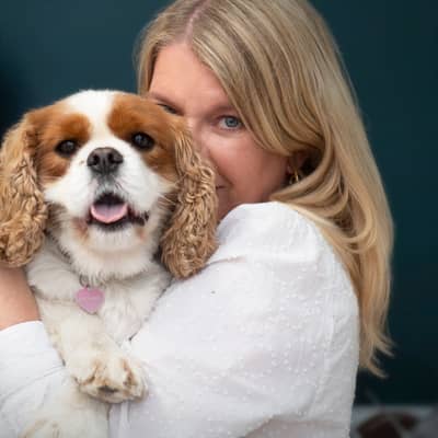 Claire Troughton holding her beloved King Charles Spaniel, Clementine