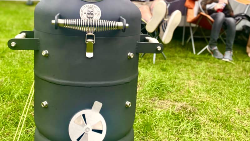 A BeardSmoke Mini-Un barbecue smoker being enjoyed whilst camping