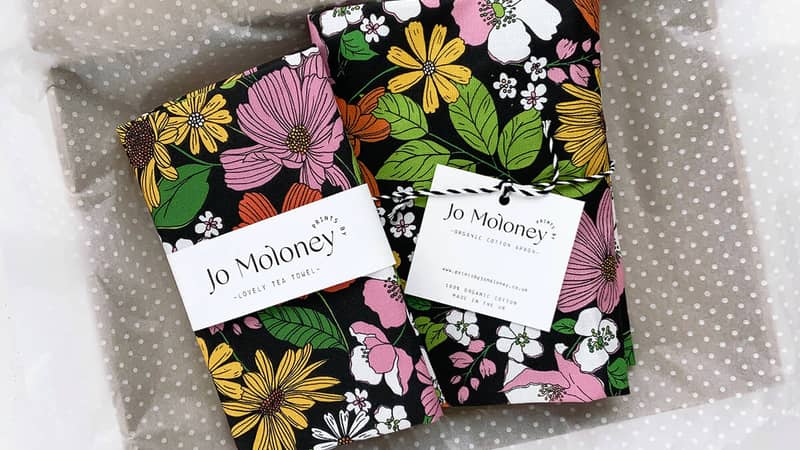 Tea towel and apron packaged in tissue paper & box