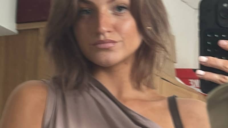 Photo of founder wearing a leather jacket and smiling.