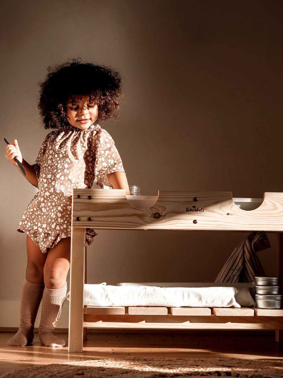 Toddler with sensory table