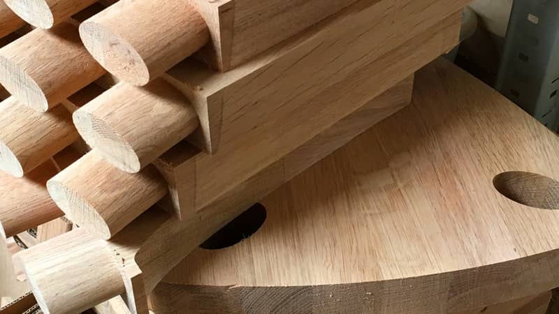 Machined pieces of solid oak pile up in the workshop during production of our personalised wooden gifts and furniture