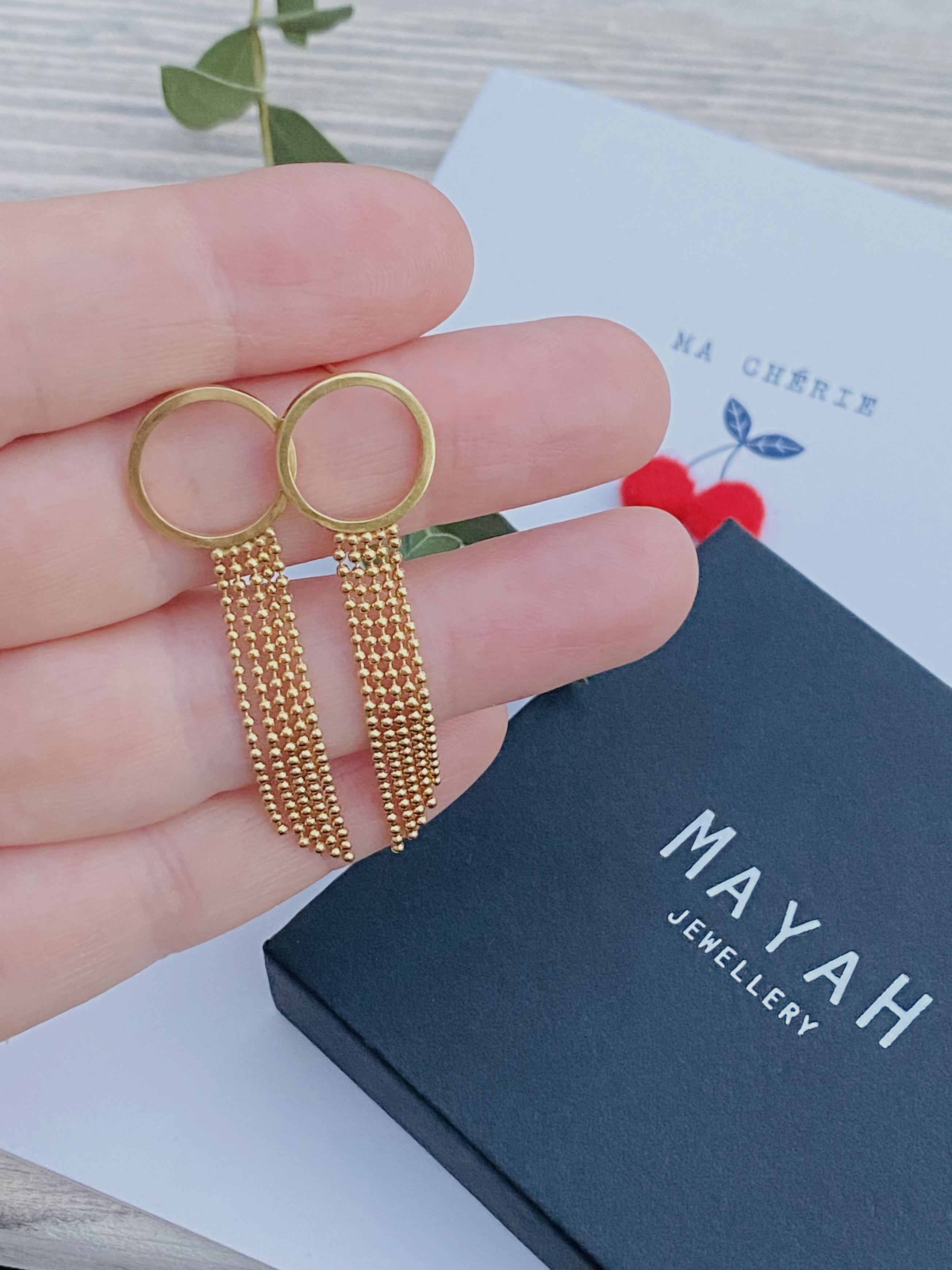 Medium twig and twig earrings on model